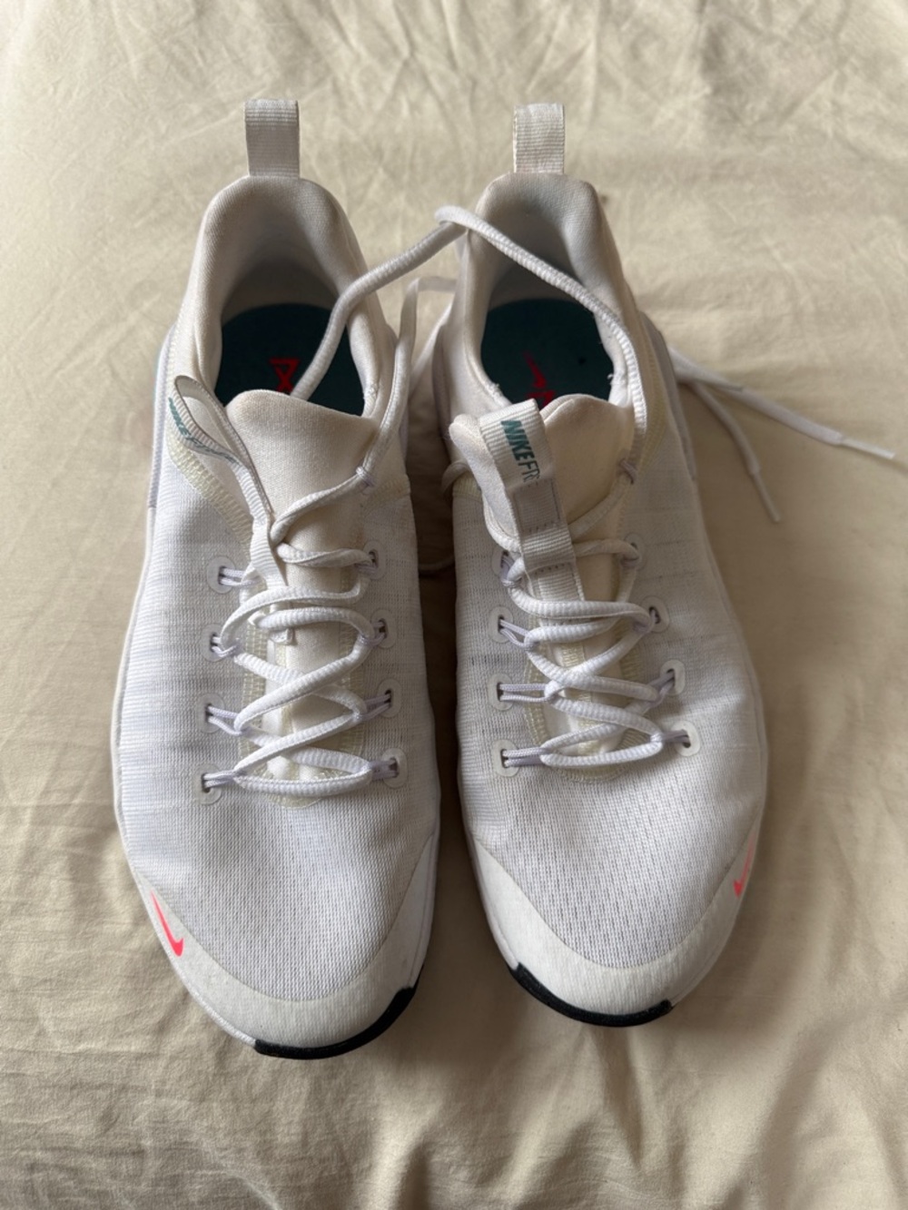 Nike White Sneakers with Pink Swoosh Accents